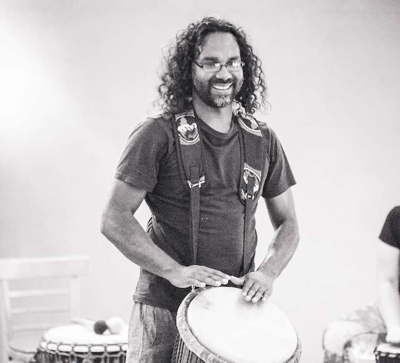 Athill Singh facilitating drumming workshop during happy buddha retreats blue mountains