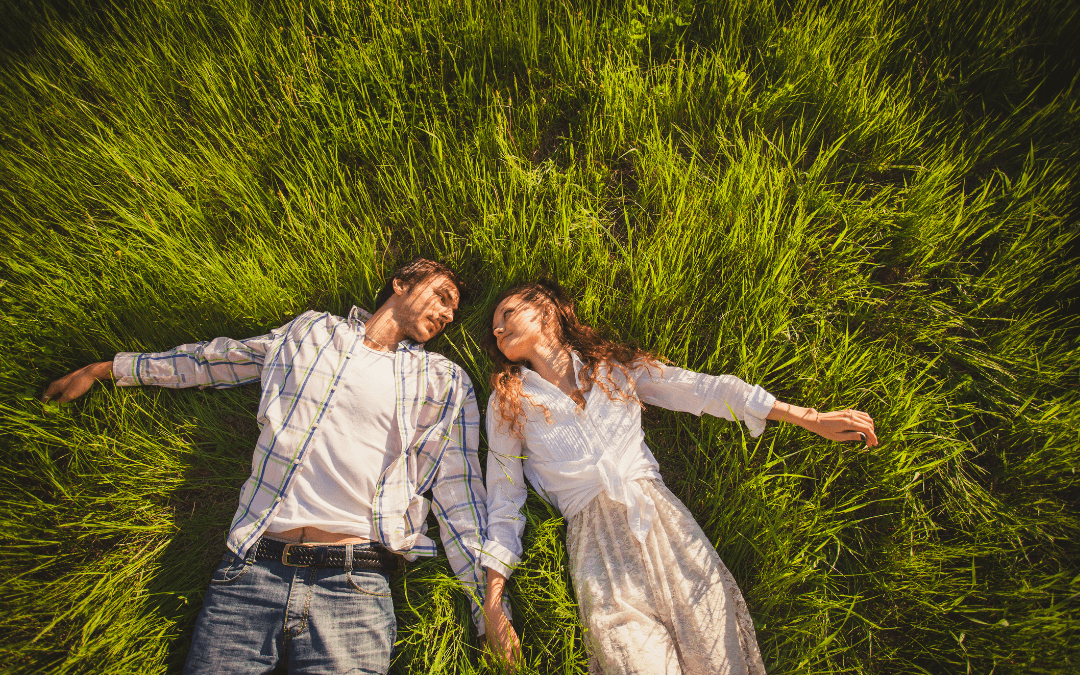 couple relaxing in grass